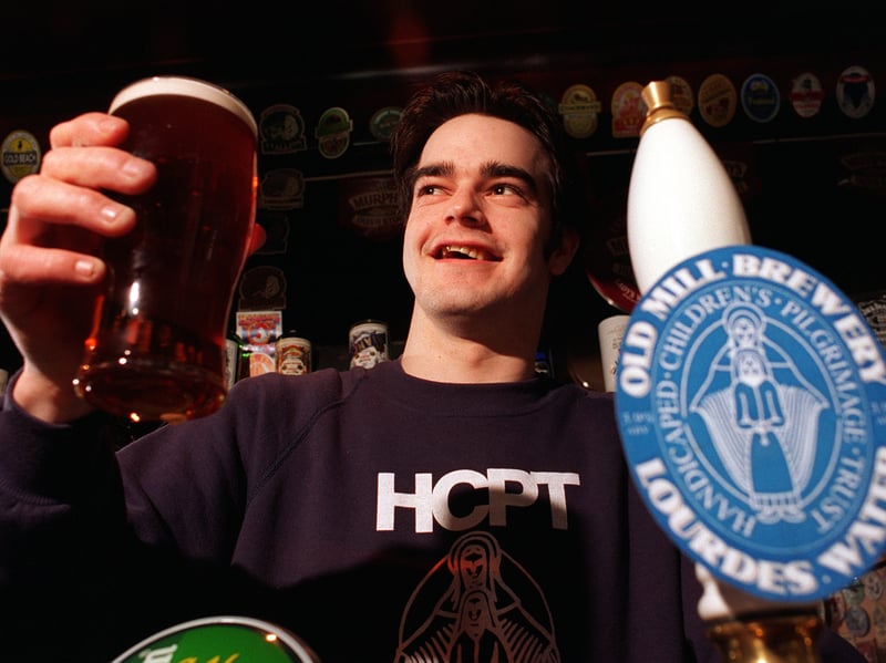 Ian McGoverin, landlord at the Beer Street pub, Dewsbury, with a pint of Lourdes Water, brewed to raise funds for the Handicapped Childrens Pilgrimage Trust's trips to Lourdes, in 1997