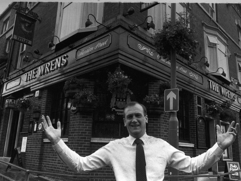 The landlord of The Wrens Pub, New Briggate, Leeds, pictured outside after it won top prize in the Leeds in Bloom awards in July 1988