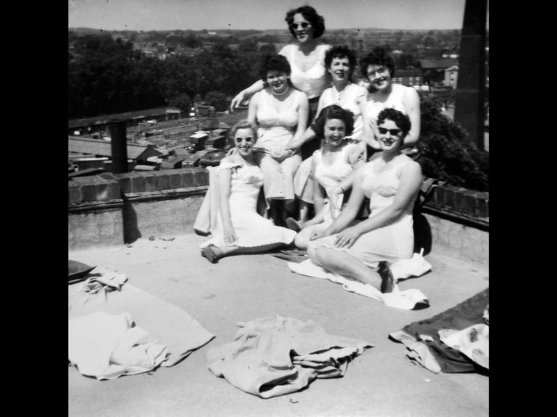Shared by Bob Paddock, this rare late-1950s photograph shows waitresses from the Boots restaurant in Pride Hill, Shrewsbury, enjoying a sunny lunch break on the store roof. At the back is Elsie Hamer, seated left is Mrs Coles (“Coley”), with Gwen Paddock in the middle and an unidentified colleague middle right. Front left is Joyce Darling, middle front is Sylvia Judson, while the woman front right was not identified. In the background is the old Smithfield cattle market.