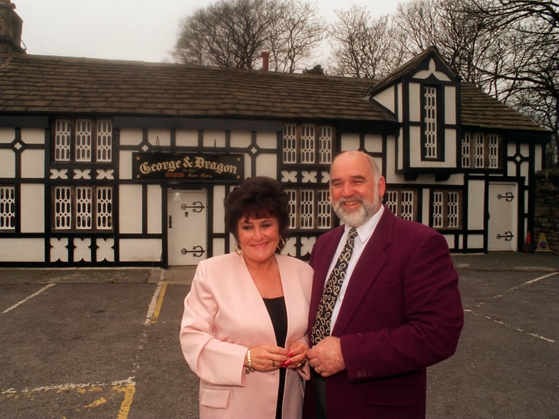 Landlords Mary and David Casper-Smith outside the George & Dragon pub, Flockton, in April 1996