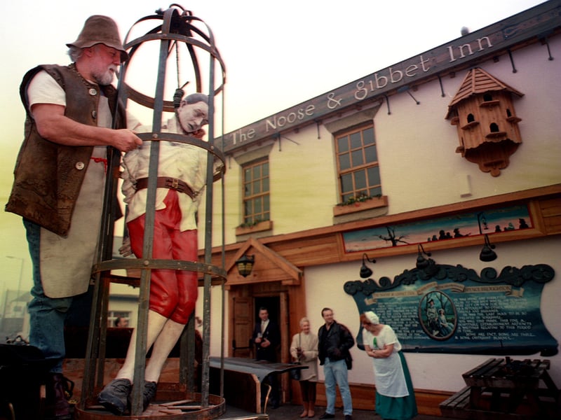Mel Humphries, landlord of the Noose & Gibbet Inn, with the new sign to be hung outside the pub, on Broughton Lane, Sheffield, in 1995