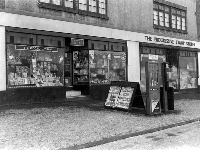 Number 402 Dewsbury Road which was the shop premises of Mrs Mabel Ellison, tobacconist and newsagent. Next door at 400 is the Progressive Stamp Store. Pictured in December 1938.