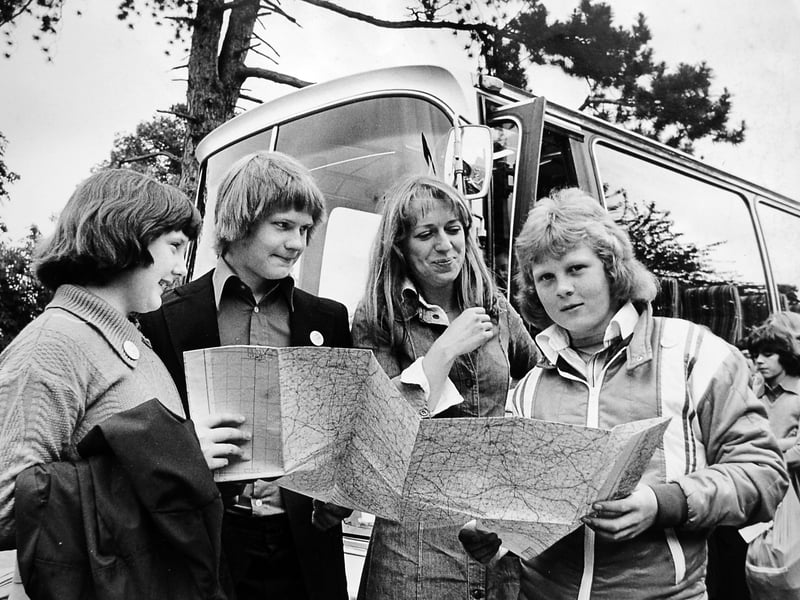 Children and teachers from Oldbury Wells School, Bridgnorth, are pictured in June 1978 just before setting off by coach for a six-day educational trip to Brittany, France. The photograph shows Katheryn Davies (12), Adrian Morris (13), Miss Alison Roose, and Simon Butler (14) among those preparing for the journey. 