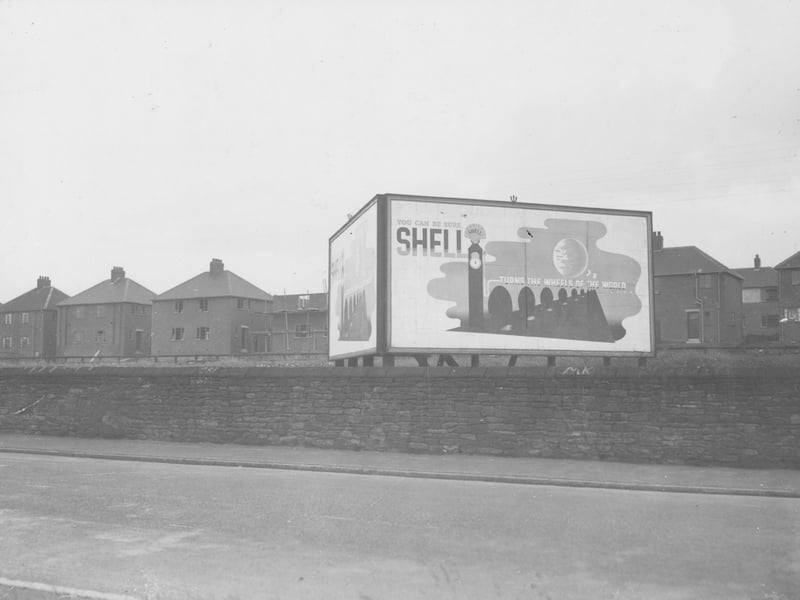 Dewsbury Road with hoarding, poster advertising shell petrol. This was near the Ring Road. Pictured in October 1938.