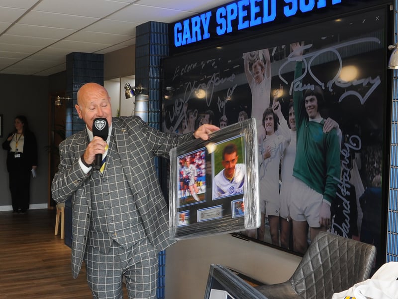 Compere Jed Stone with one of the raffle prizes at the Billy Bremner Gala Dinner