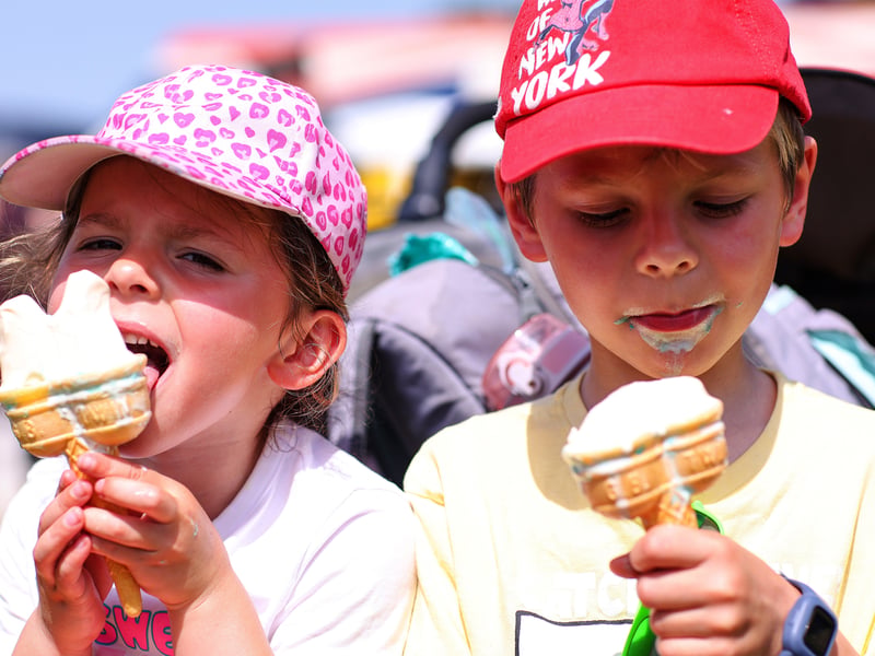 Siblings, Letty, 4, and Ellis, 6, enjoy an ice cream at The Overlord Show 2026.
