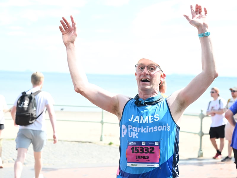 'James' threw his arms in the air when he saw the photographer.