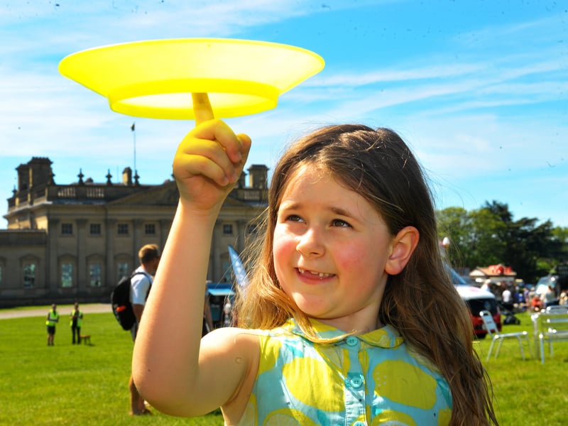 Cora Blanchard, six, of Leeds, plate spinning at the circus tent