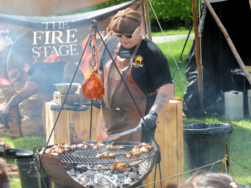 Wayne Smith, the Daddy Bear Grills, demonstrating how to smoke meat.