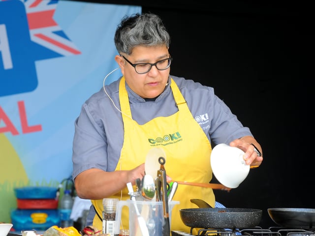 Maz Linford-Platt cooking  at The Vegetarian Society tent.