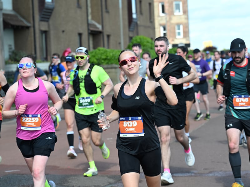 This runner waved for the cameras as she passed through Portobello.