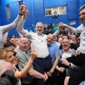 Seán Kyne is lifted by supporters along with Minister Peter Burke and Fine Gael leader Simon Harris