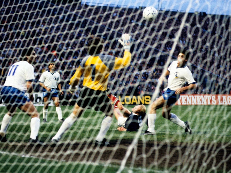 Another overhead kick – who doesn’t like an overhead kick? Pat Nevin sends in a deep cross from the right, Richard Gough heads back into the danger area and the ball is inadvertently flicked up by a defender attempting to clear. Johnston flips himself up on the edge of the six-yard box and before anyone knows it, the ball’s in the net, for the opener in a 2-1 World Cup qualifying win.