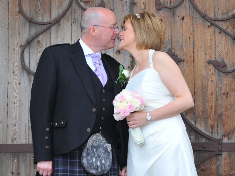 The wedding of SNP Deputy First Minister Nicola Sturgeon to Peter Murrell. The couple posing outside Oran Mor in Glasgow's West End.