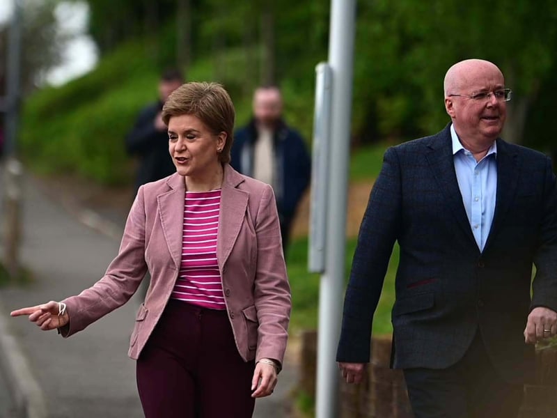First Minister of Scotland Nicola Sturgeon with husband Peter Murrell at a polling station at the Local Council Electin on May 5, 2022.