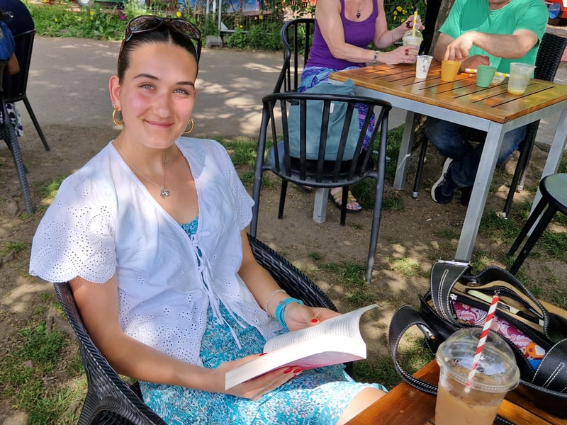 Enjoying a book in the shade in Endcliffe Park. Photo: Iconic Media