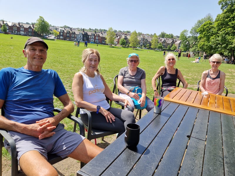 Friends enjoy the sun near Encliffe Park cafe. Photo: Iconic Media