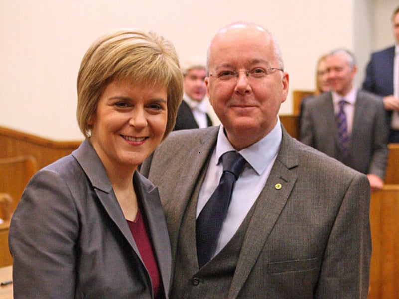 SNP leader Nicola Sturgeon poses with husband Peter Murrell and her seal of office after being formally sworn in as Scotland's first minister at the Court of Session in Edinburgh on November 20, 2014.