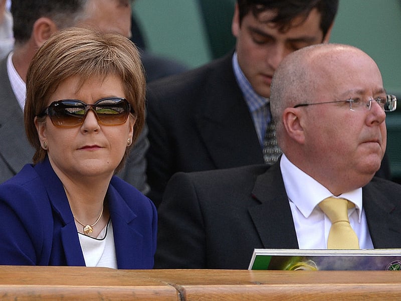 Leader of the Scottish National Party Nicola Sturgeon and her husband Peter Murrell take their seats in the royal box on centre court to watch the women's singles final between US player Serena Williams and Spain's Garbine Muguruza on day twelve of the 2015 Wimbledon Championships at The All England Tennis Club in Wimbledon.