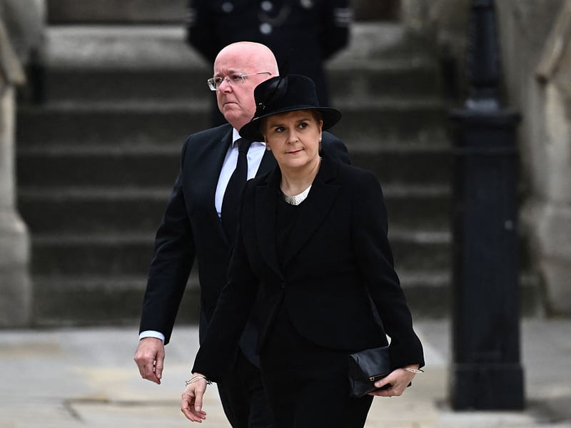 First Minister of Scotland Nicola Sturgeon and her husband Chief Executive Officer of the Scottish National Party Peter Murrell arrive at Westminster Abbey in London on September 19, 2022, for the State Funeral Service for Britain's Queen Elizabeth II. 