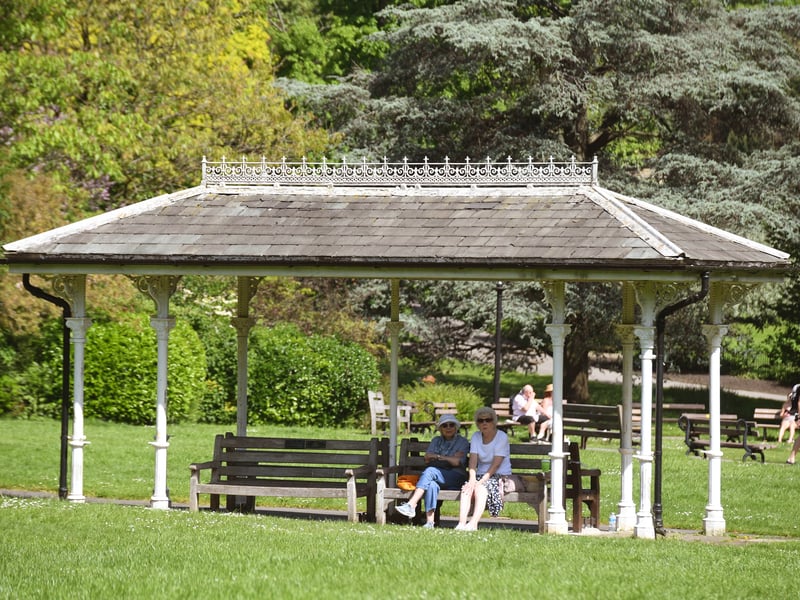 A couple take a breather in the shade in Valley Gardens, Harrogate