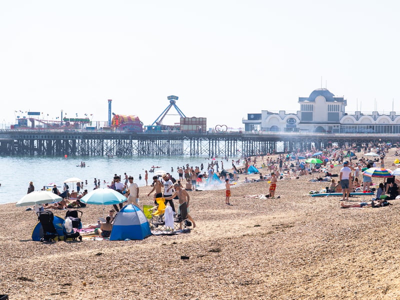People enjoying the bank holiday sun at Southsea Beach. Pictured by Alec Chapman