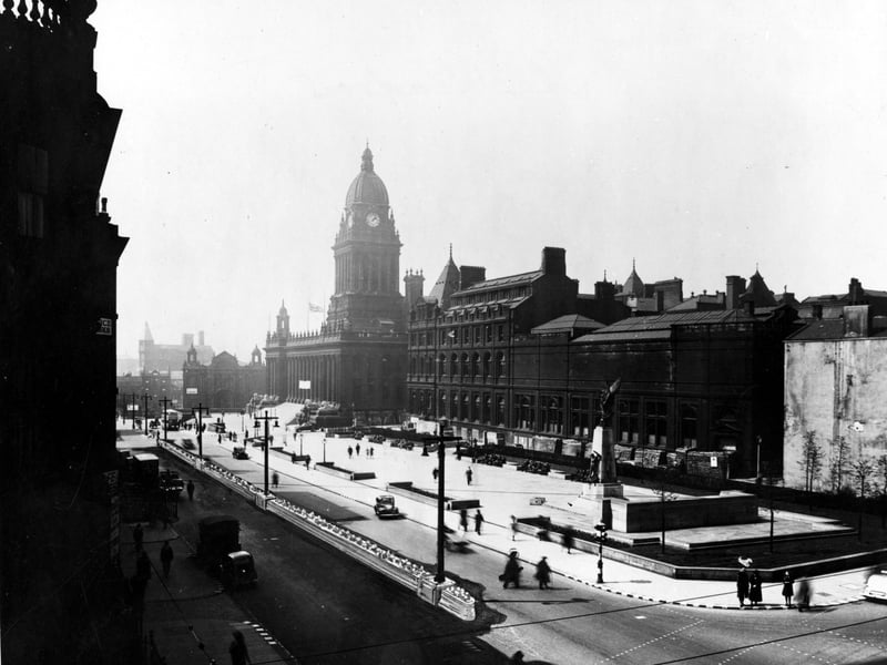 An elevated view showing traffic on The Headrow, taken from the junction with Park Row and Cookridge Street. The edifices of The Town Hall, Municipal Buildings, Art Gallery and The Bank of England can be seen, as well as the War Memorial. Pictured in October 1943.