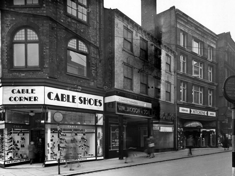 A view looking west along Kirkgate showing shops at nos. 126 -135 Cable Shoes, W. Jackson and Son Ltd. confectioners, Brown's footwear (closing down) and Hitchen and Sons Ltd. fancy drapers. Pictured in November 1943.