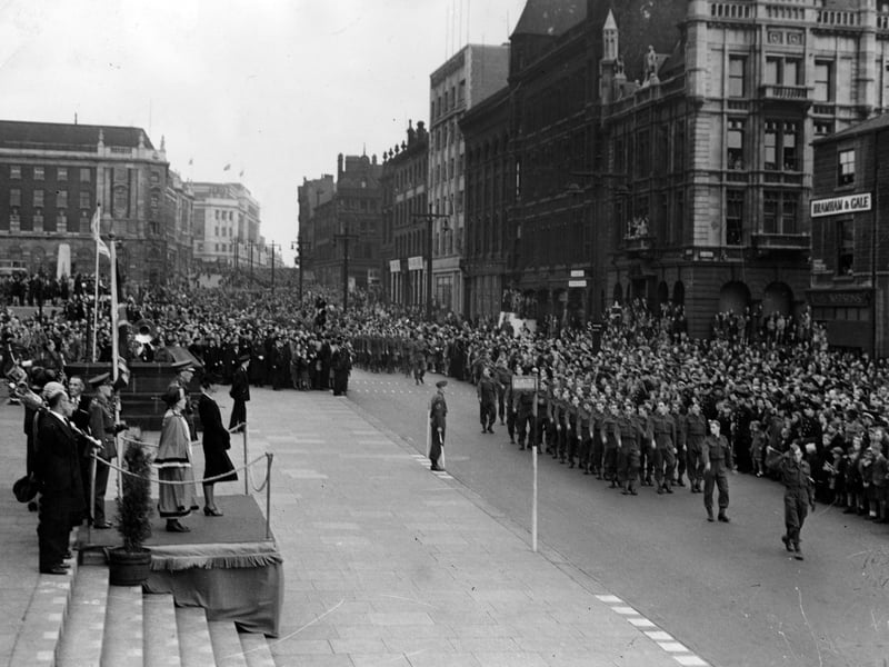 The Duchess of Kent (Princess Marina) taking the salute at a march past of youth organisations on The Headrow in November 1943. The Duchess is to the front of the podium on the left, which had been put up on the steps of Leeds Town Hall. The Lord Mayor is Miss J.B. Kitson.
