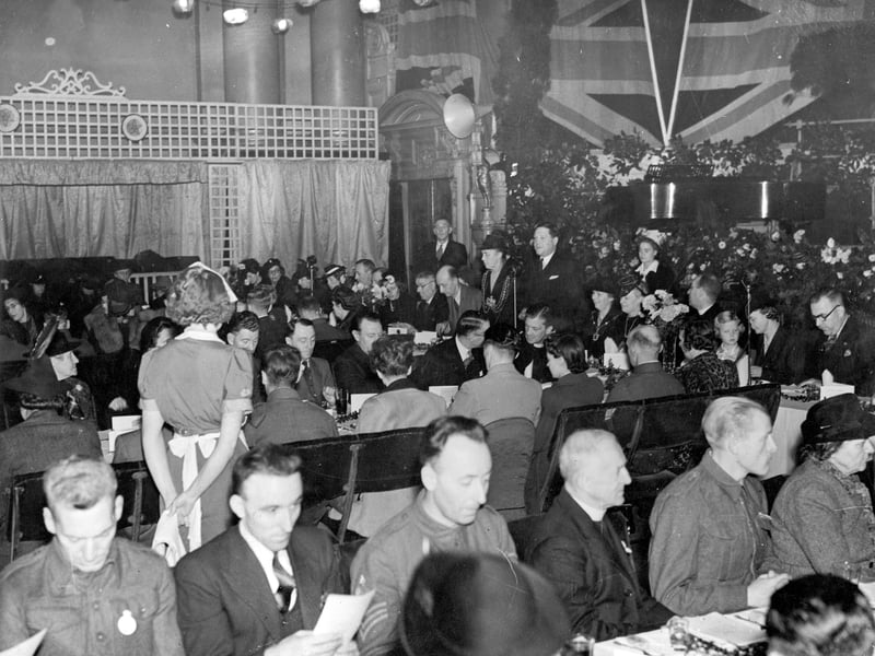 POW lunch at Leeds Town Hall in November 1943. More the 100 repatriated POW and their families were entertained to lunch. The Lord Mayor Miss Jessie B. Kitson is making a speech of welcome, on her right is Mr F. Heywood. He was General Manager of the Yorkshire Evening News, who had sponsored the event and ran the POW club.