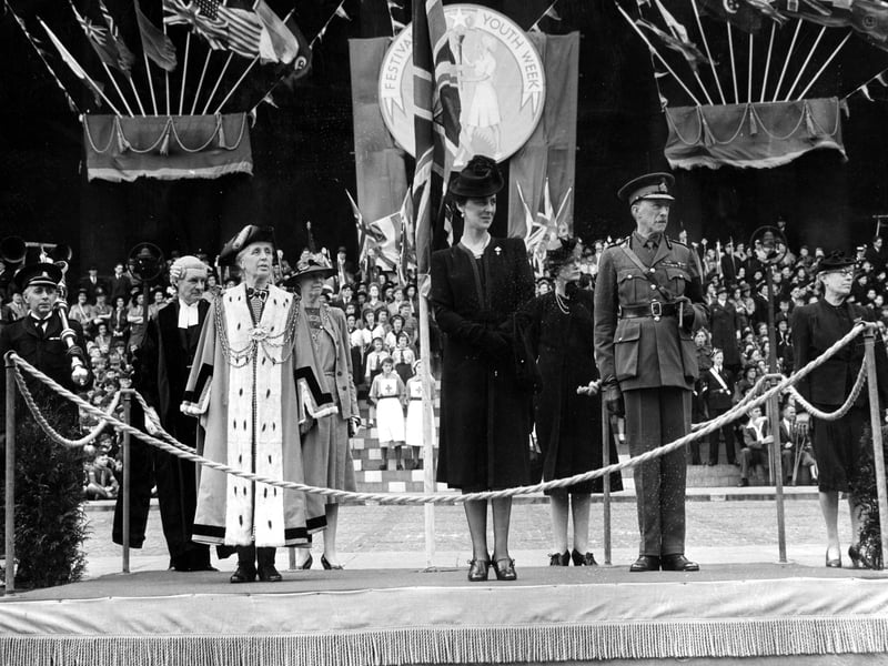 In the centre of the view is the Duchess of Kent, taking the final march past salute at the end of the Festival of Youth in November 1943. 