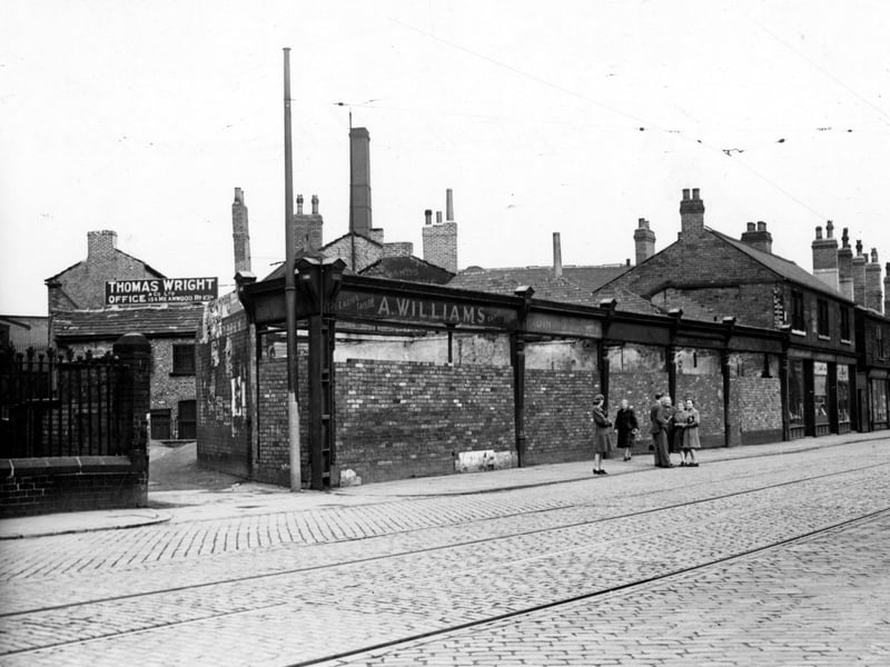 The north side of Meanwood Road, showing ruins and T. Wright's leather dressers. Pictured in June 1948.