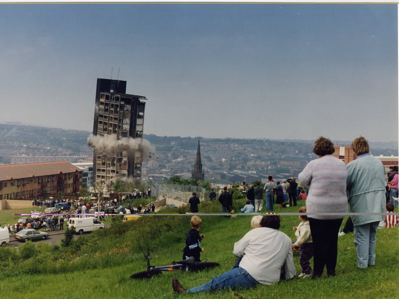 People look on as one of the blocks in Sheffield's Hyde Park flats complex, completed in 1965, is demolished in June 1993