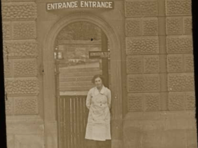 A woman pictured at the Edinburgh Zoo entrance shortly after it opened in 1913.