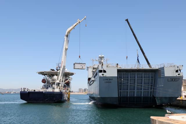 HMS Stirling Castle cranes on equipment to RFA Lyme Bay in Gibraltar. The auxiliary vessel will be proceeding to the Gulf.