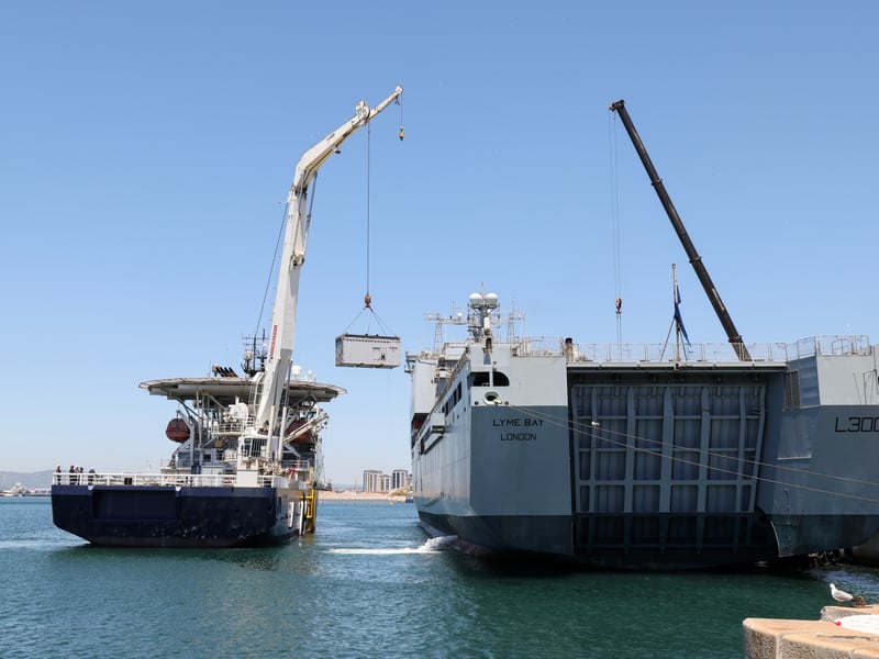 HMS Stirling Castle cranes on equipment to RFA Lyme Bay in Gibraltar. The auxiliary vessel will be proceeding to the Gulf.