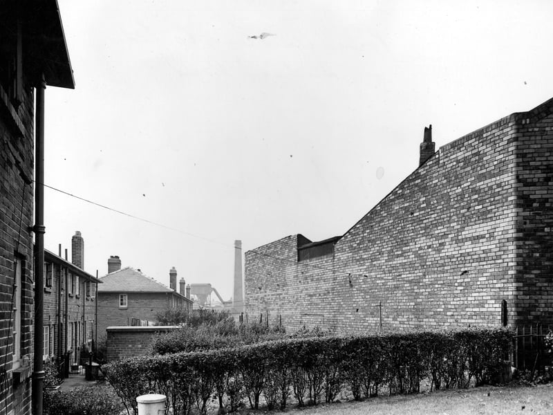 Back Wall of factory premises of Power Unit Engineering Co. Ltd on Hudson Road. To left of photo from October 1948 can be seen backs of houses, with back gardens leading up to factory wall.