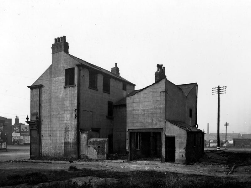 York Road in October 1945. Side and rear views of nos. 79 and 79A York Road at the junction with Searle's Yard. The back of the former Post Office building is three storey brick and rendered construction with missing windows. Site around it is waste land.