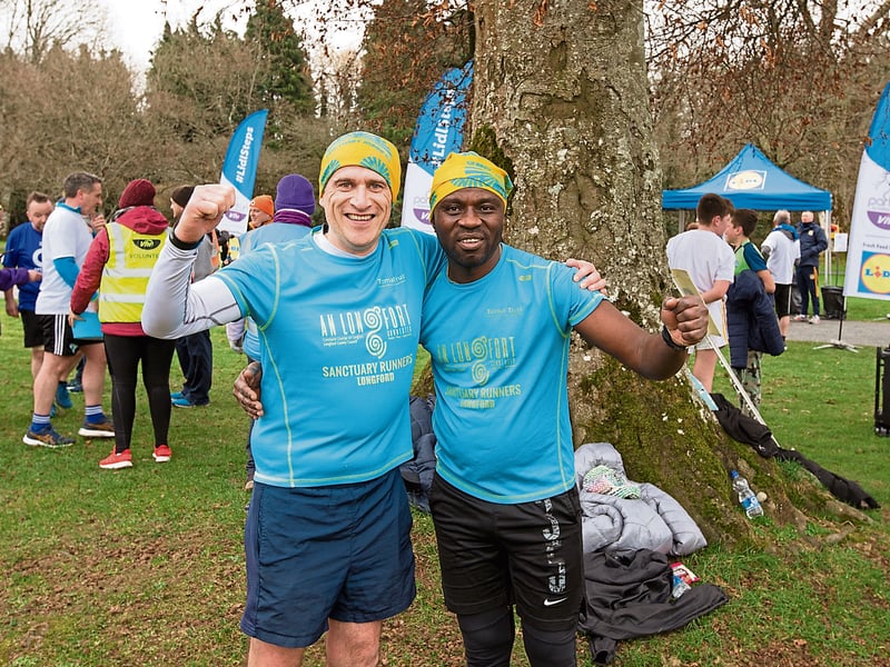 Gavin McHugh alongside Ojo Wolex. Gavin is a representative of The Sanctuary Runners, working with people in direct provision, helping them with ease into the community