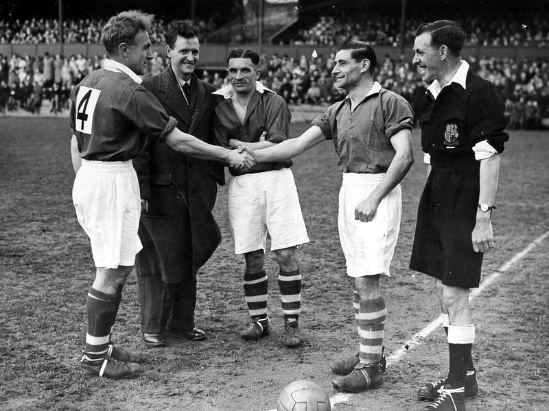 A benefit match at the Gay Meadow football ground, believed to date from the late 1940s or 1950s. The photograph shows Shropshire footballers including Wolves and England legends Billy Wright and Johnny Hancocks, with Dawley-born Shrewsbury Town player Jackie Butler seen on the right shaking hands with Wright. Butler was the focus of the benefit match, recognised for his contribution to Shrewsbury Town and local football, and is pictured alongside some of the county’s greatest ever players