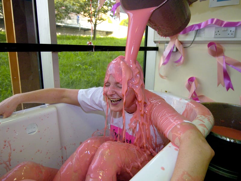 October 2006 and Roy Thorpe, principal of Thomas Danby College, pour's pink coloured custard over Sarah Towns, from the marketing department, to help raise money for Breast Cancer Campaign .