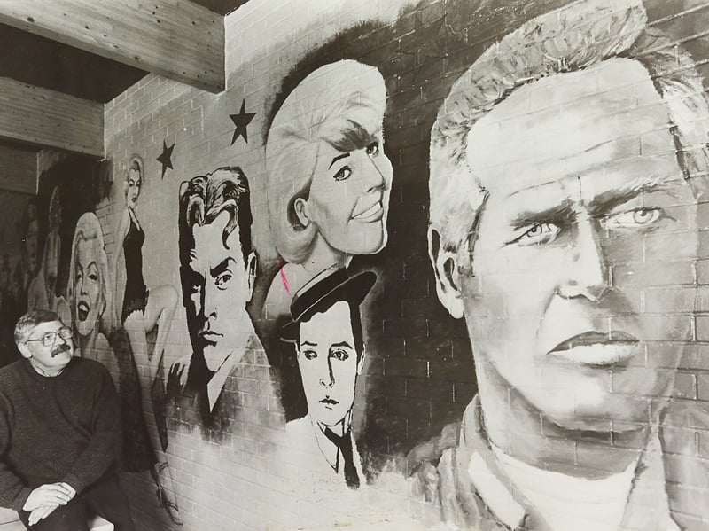 Artist Mike Bell puts the finishing touches to a mural of famous film stars at Strawberrys nightclub on Leabrook Road, Wednesbury, in March 1989. The colourful artwork brought a splash of Hollywood glamour to one of the area's popular nightspots. Do you remember Strawberrys, or spotting this mural on a night out?