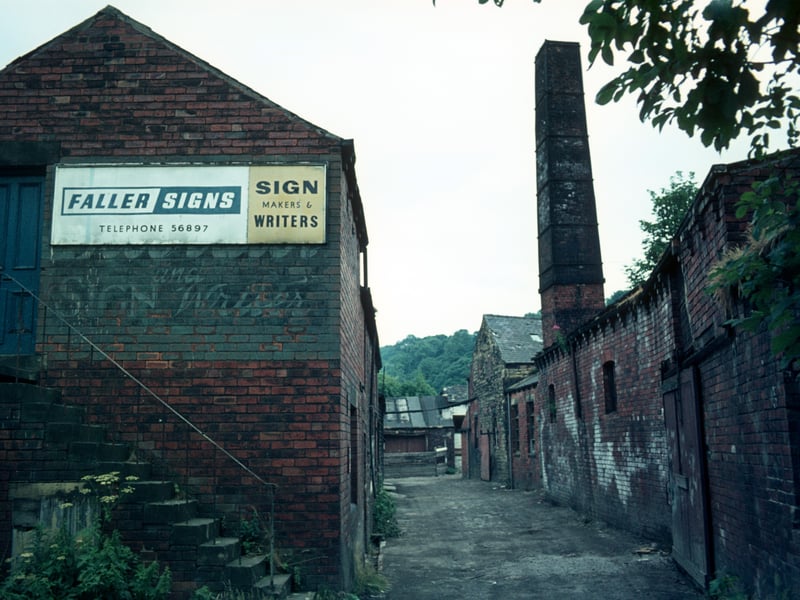 Derelict buildings of Woodlands Dyeworks on Wood Lane in July 1975 shortly before demolition. Known as Crowther's Mill and previously Rowley's Mill and Wood's Mill, there is believed to have been a mill on the site since 1601. 