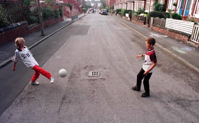 Liall Bolens and Chris McQuade play football on Methley Terrace before Transport 2000 and the local residents turfed the street.