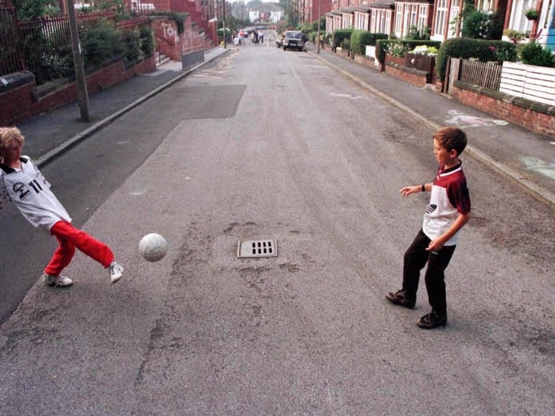 Liall Bolens and Chris McQuade play football on Methley Terrace before Transport 2000 and the local residents turfed the street.