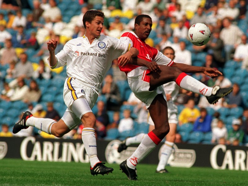 Leeds United's Andy Couzens battles with veteran Viv Anderson playing for Arsenal.