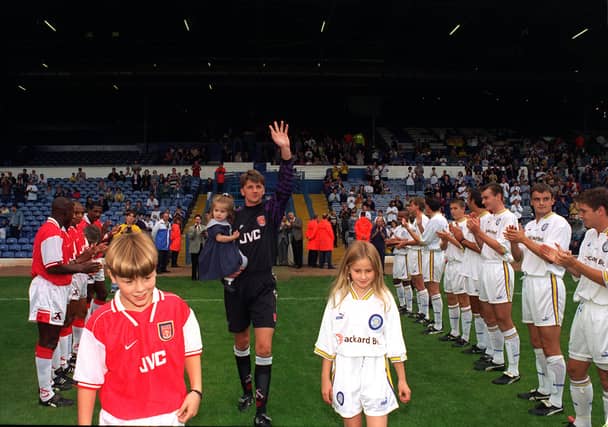John Lukic walks out with daughters Zoe, 2, Amy, 9, and son John, 10.