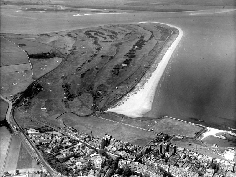 An aerial view of St Andrews golf course, beach and town taken in June 1960.