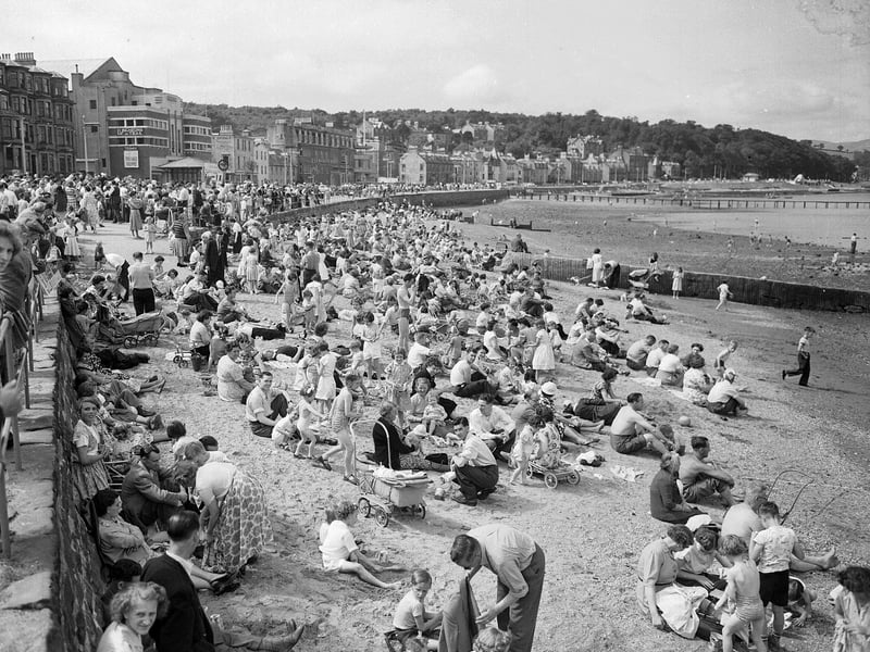 Holidaymakers crowd the beach during the Glasgow fair holiday in Rothesay in July 1955.