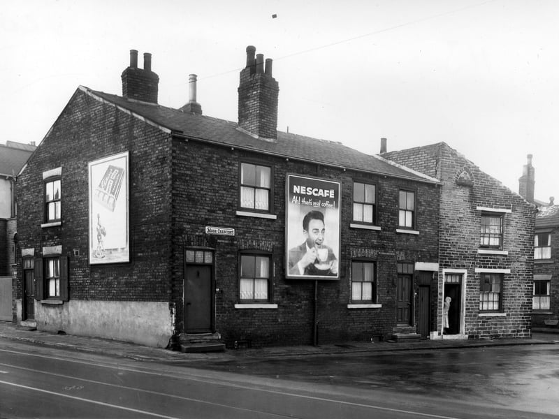Moor Road and Moor Crescent pictured in  December 1958. A woman stands in the doorway of number 78 and just visible on the far right is Drayton Manor Yard.